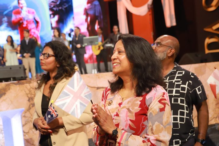 Delegate waving a flag at the gathering