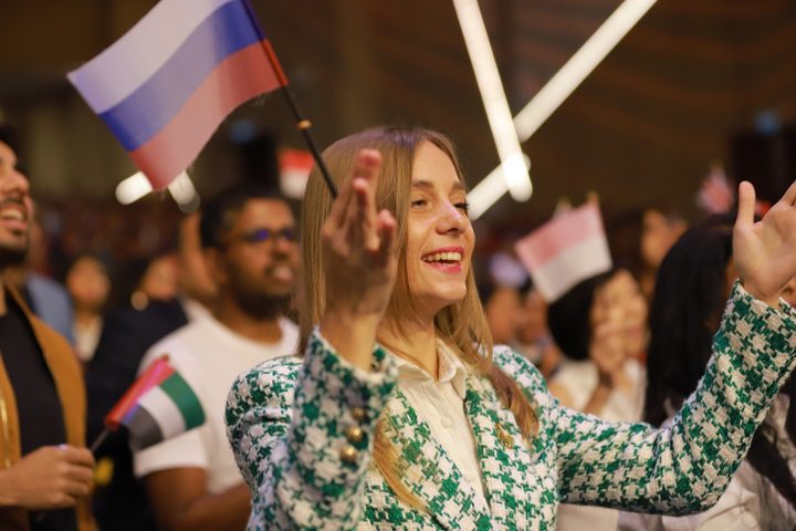 Delegates celebrating with national flags
